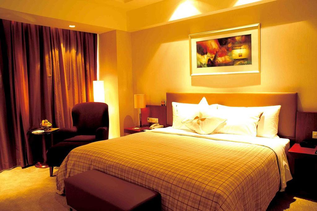 Merryland Traders Hotel Changshu Quarto foto