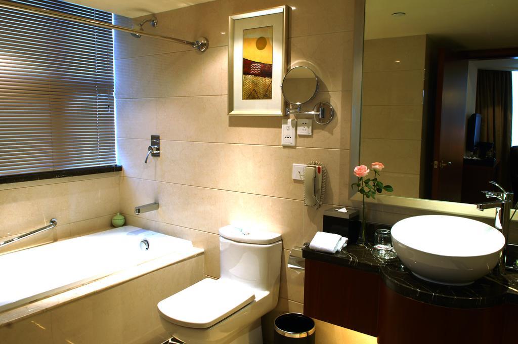 Merryland Traders Hotel Changshu Quarto foto